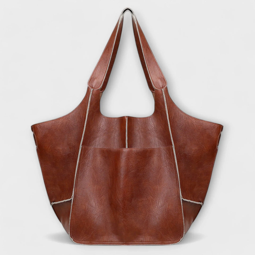 Khaki spacious faux leather women's tote, versatile for travel & everyday adventures.