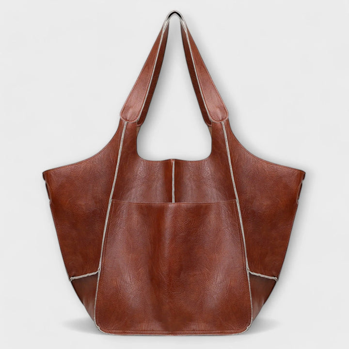 Khaki spacious faux leather women's tote, versatile for travel & everyday adventures.