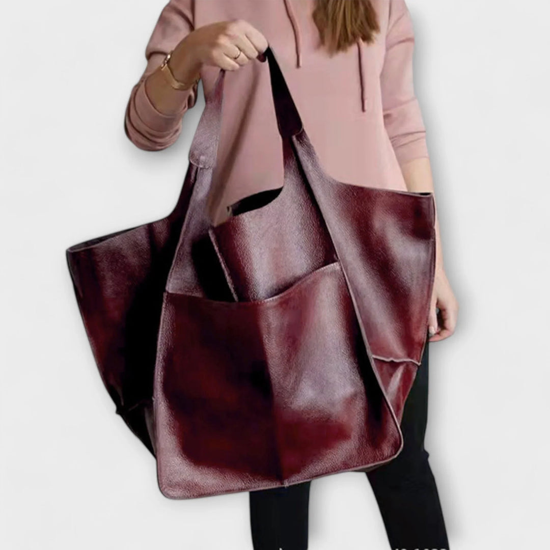 Bold red faux leather women's tote, stylish & practical, perfect for adding color.