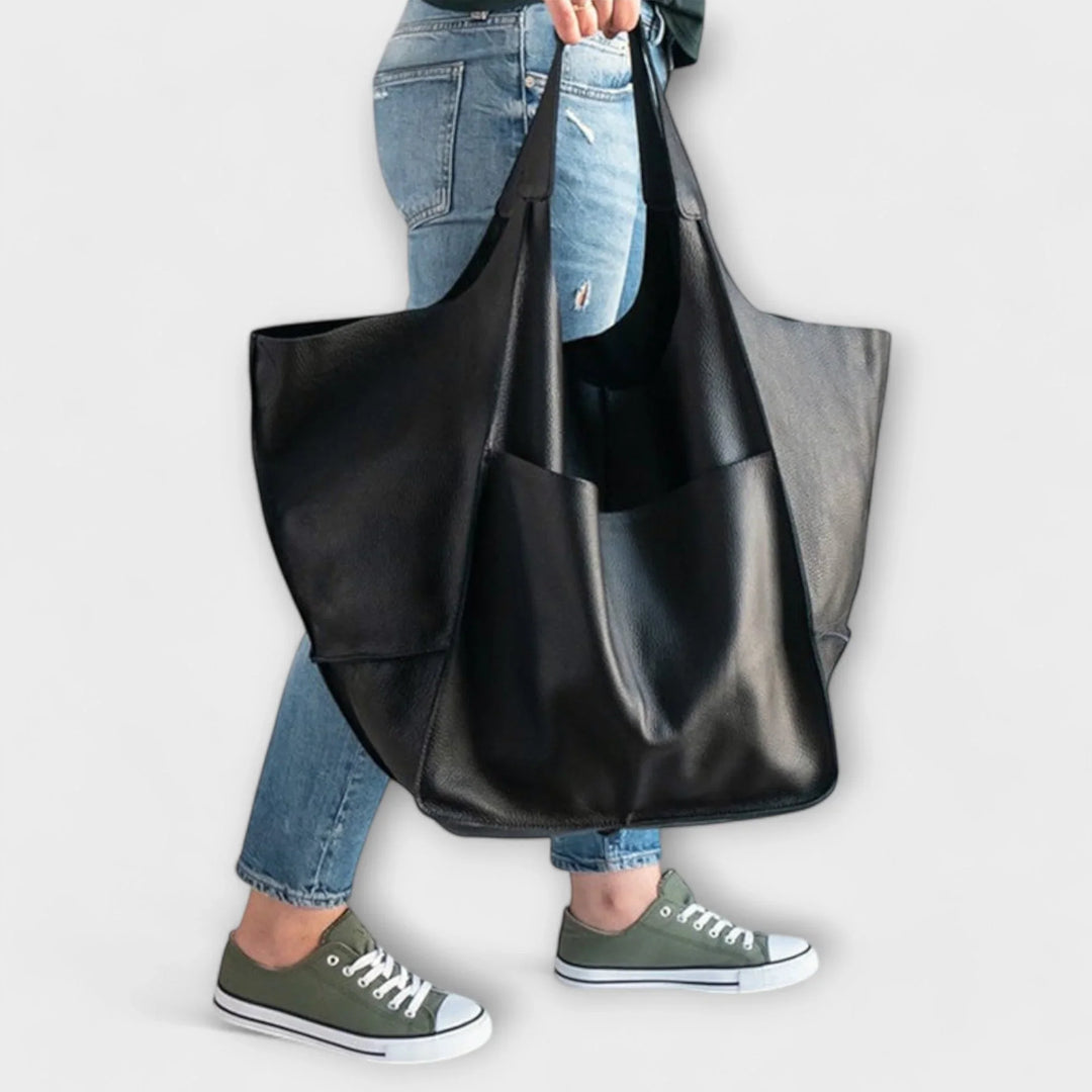 Classic brown faux leather women's tote bag, versatile and chic for year-round use.