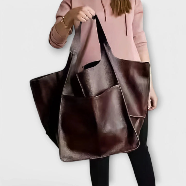 Sophisticated black faux leather tote bag, women's versatile handbag for professional look.