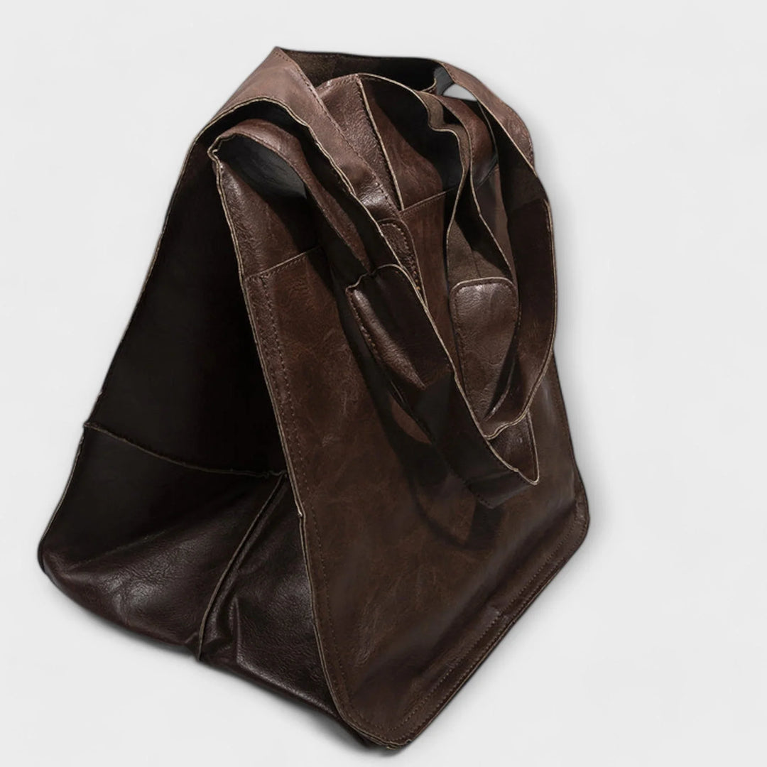 Chic red women's tote bag, faux leather, spacious interior, elegant & practical.