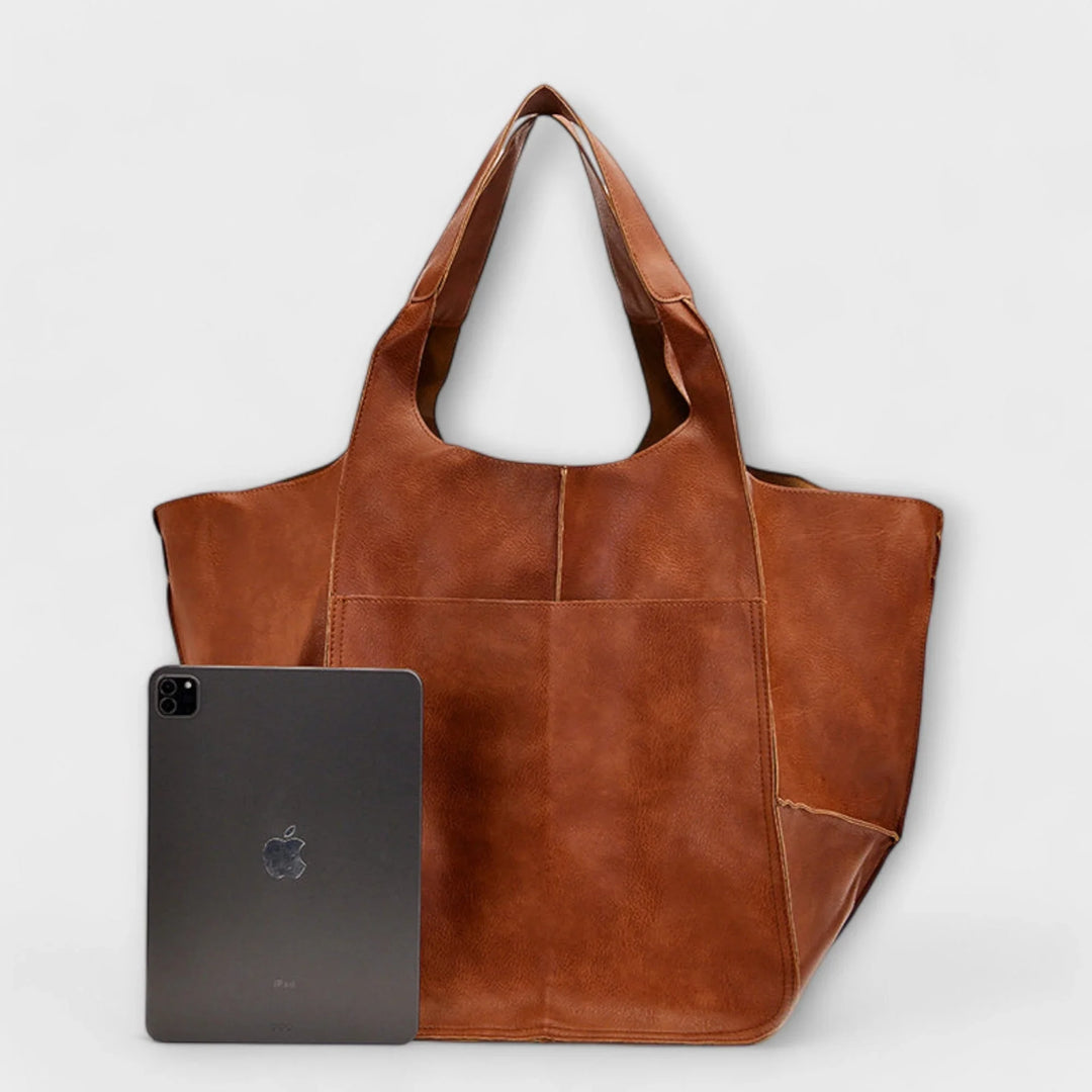 Brown versatile faux leather tote bag for women, spacious & perfect for daily essentials.