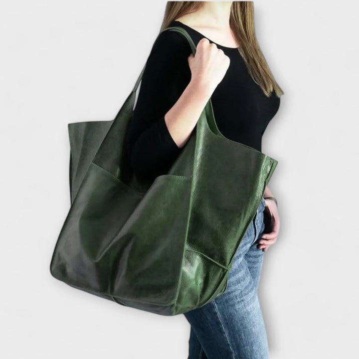 Stylish black faux leather tote bag, women's versatile handbag with a modern design.