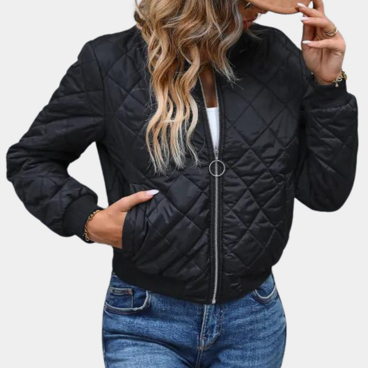 Black women's full-zip bomber jacket, perfect for urban style. Features a puffer design, ribbed cuffs, and casual outerwear.