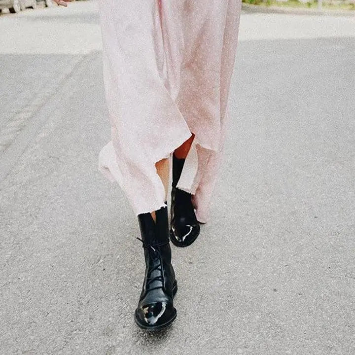 Versatile brown women's lace-up boots. Elegant & comfortable ankle footwear for stylish outfits.