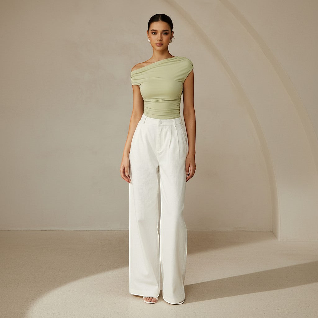 Women's asymmetrical one shoulder top, ruched detailing, fitted for a sleek silhouette.