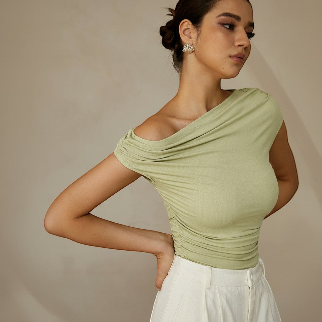 Stylish black fitted top with one shoulder & ruched design, versatile for casual or evening.