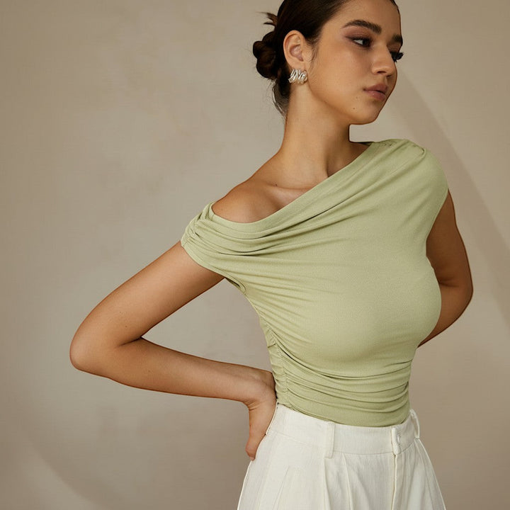 Stylish black fitted top with one shoulder & ruched design, versatile for casual or evening.