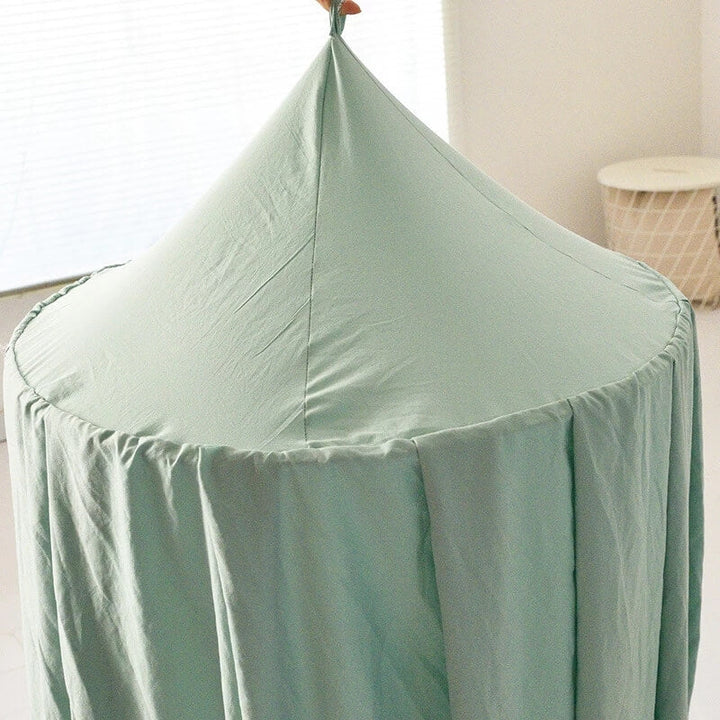 Children's light-blocking bed canopy acting as a cozy reading nook or private play area.