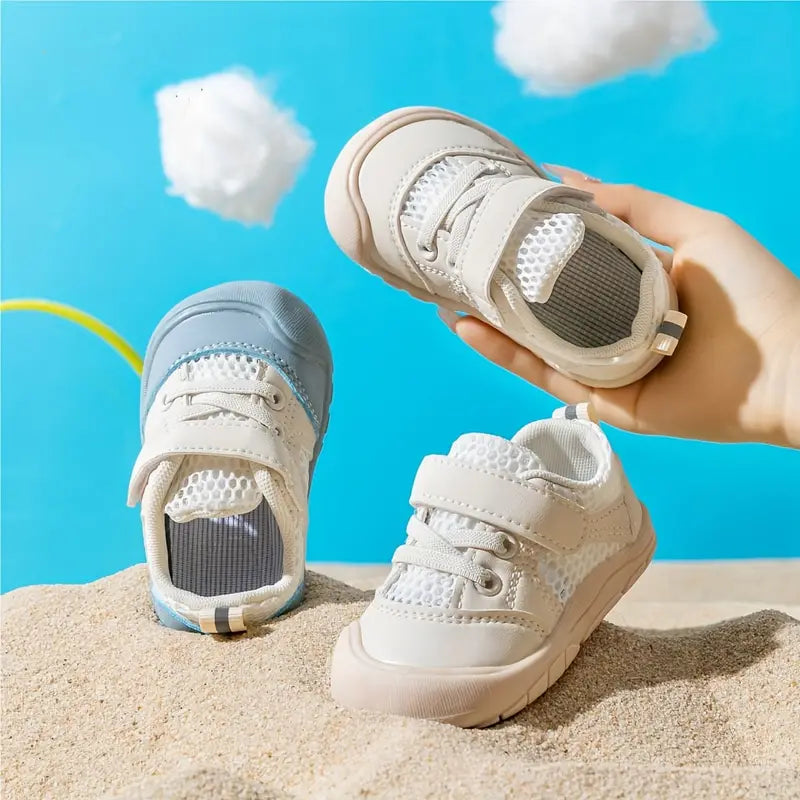 Blue baby barefoot sneakers with wide toe box for natural foot development.