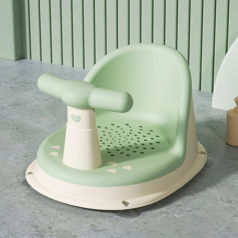 Close-up of a blue baby non-slip bath seat, highlighting safety features and soft-touch material.