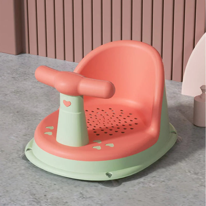 Parent's perspective of a child using a pink non-slip bath seat with adequate backrest support.
