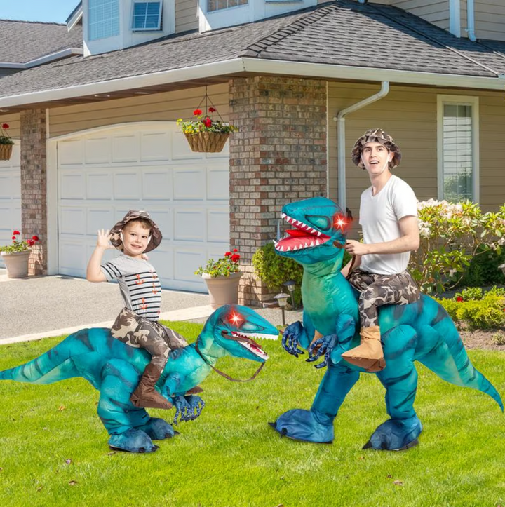 Giant blue dinosaur ride-on inflatable toy for adults & children's active outdoor fun.