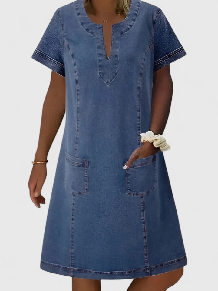 Blue women's comfortable flowy midi dress with pockets, perfect for casual everyday wear or a summer outing.
