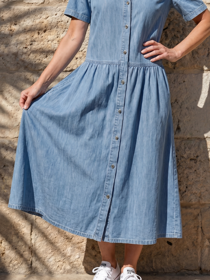 Stylish blue women's midi dress featuring a gathered waist, full button-front, short sleeves & a classic collar.