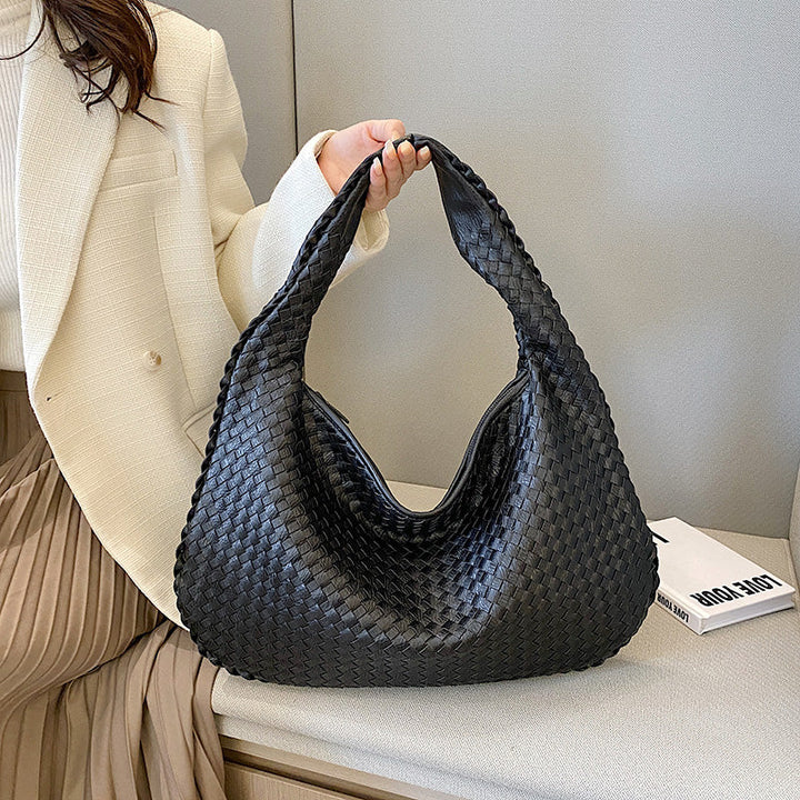 Brown braided leather hobo bag, a fashionable accessory for any outfit