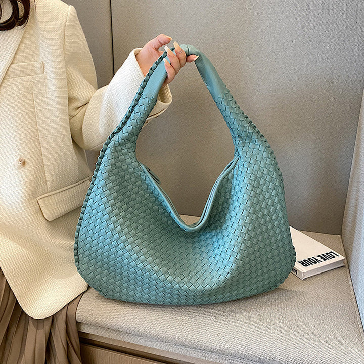 Woven leather hobo bag with a relaxed bohemian aesthetic