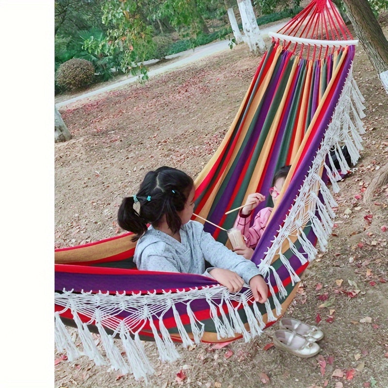 Relaxing cotton double hammock, perfect for indoor lounging or outdoor garden comfort.