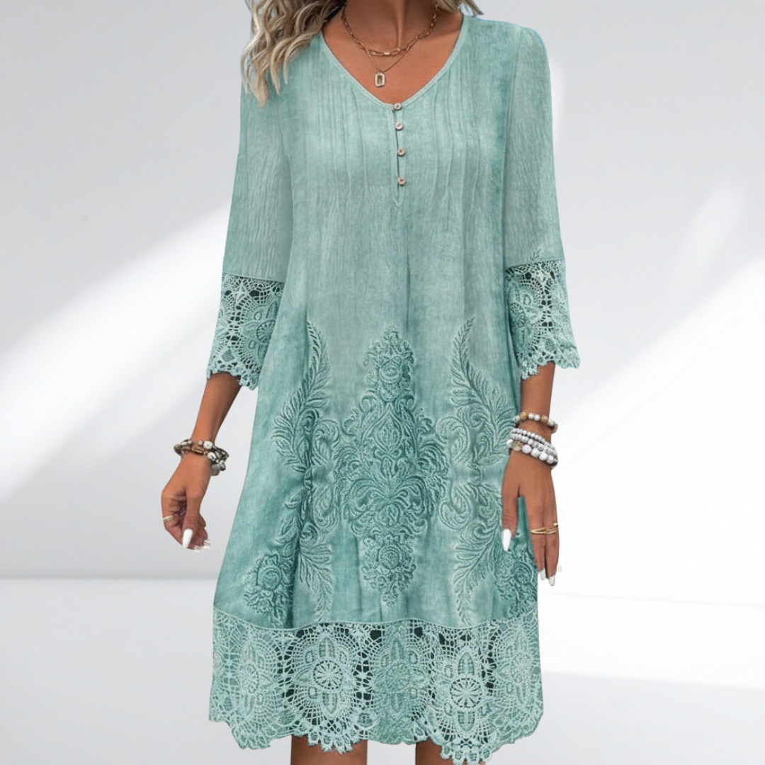 Bohemian embroidered midi dress with intricate floral details and delicate lace trim