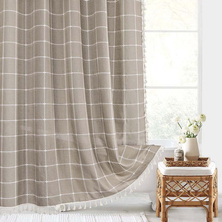 Waterproof linen shower curtain with a charming bohemian farmhouse plaid design.