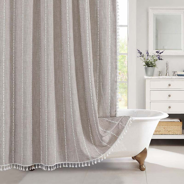 Farmhouse style waterproof linen shower curtain with subtle bohemian accents and texture.