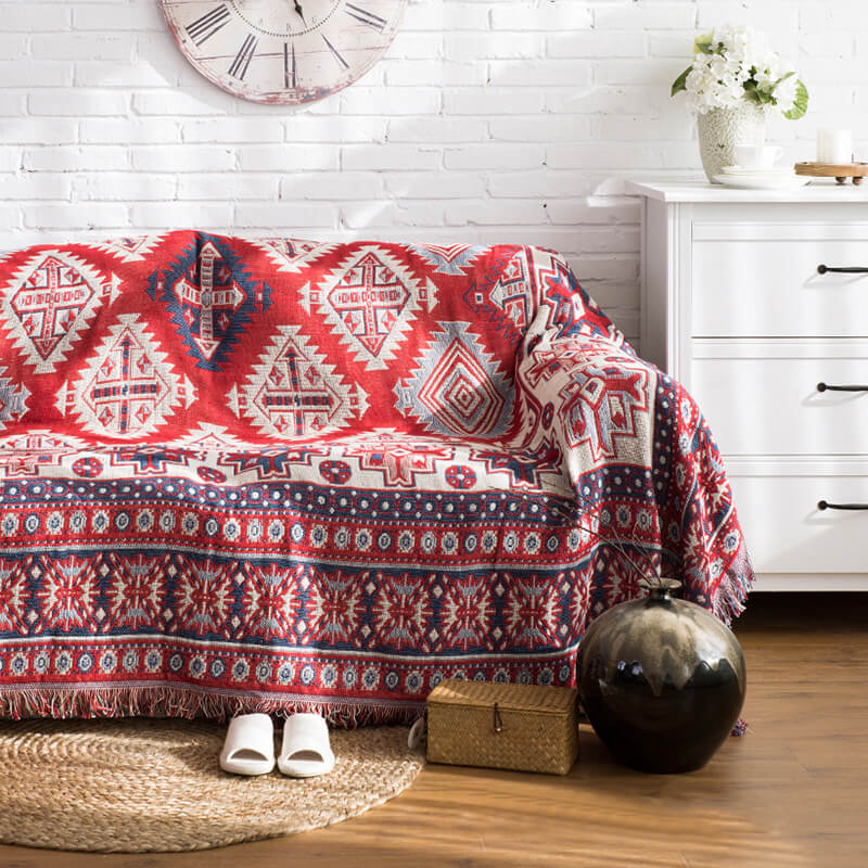 Large bohemian knitted blanket with tassels, ideal for snuggling on the sofa.