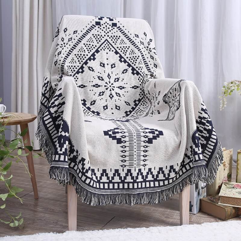 Elegant bohemian tassel knitted sofa blanket, a cozy and decorative piece.