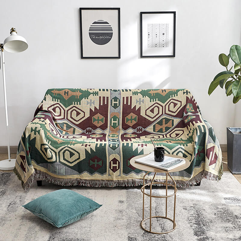 Accent bohemian knitted throw with decorative tassels for a cozy living space.