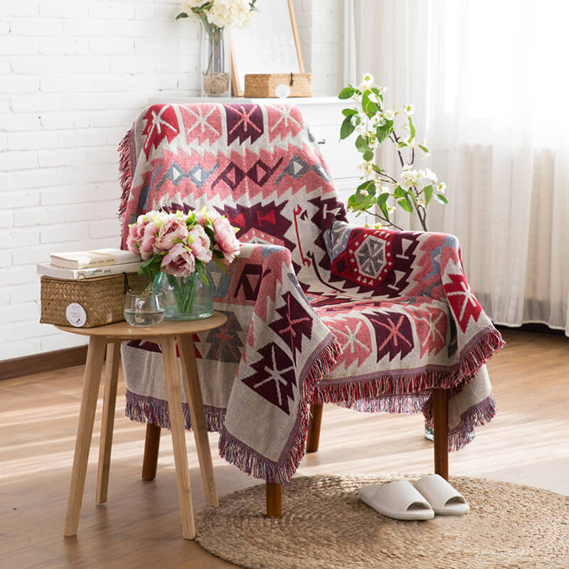 Modern bohemian knitted throw blanket with stylish tassels for contemporary homes.