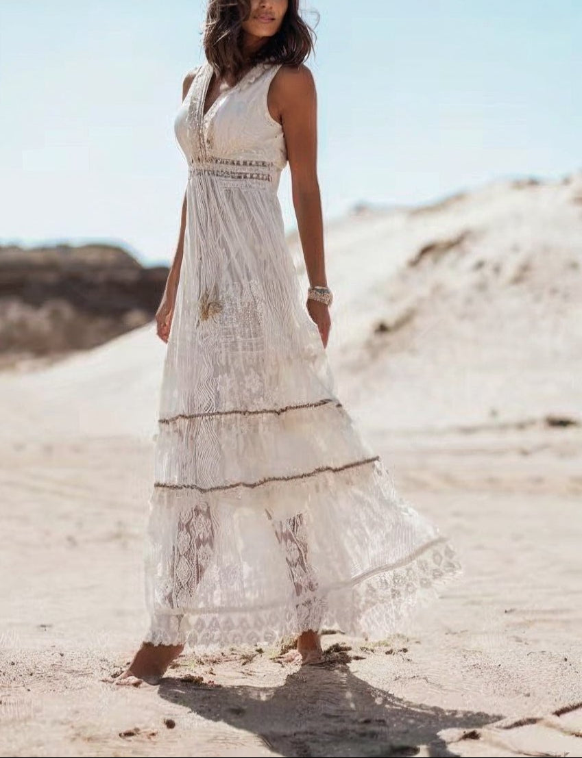 Sleeveless V-neck boho maxi dress in white lace, ideal for summer.
