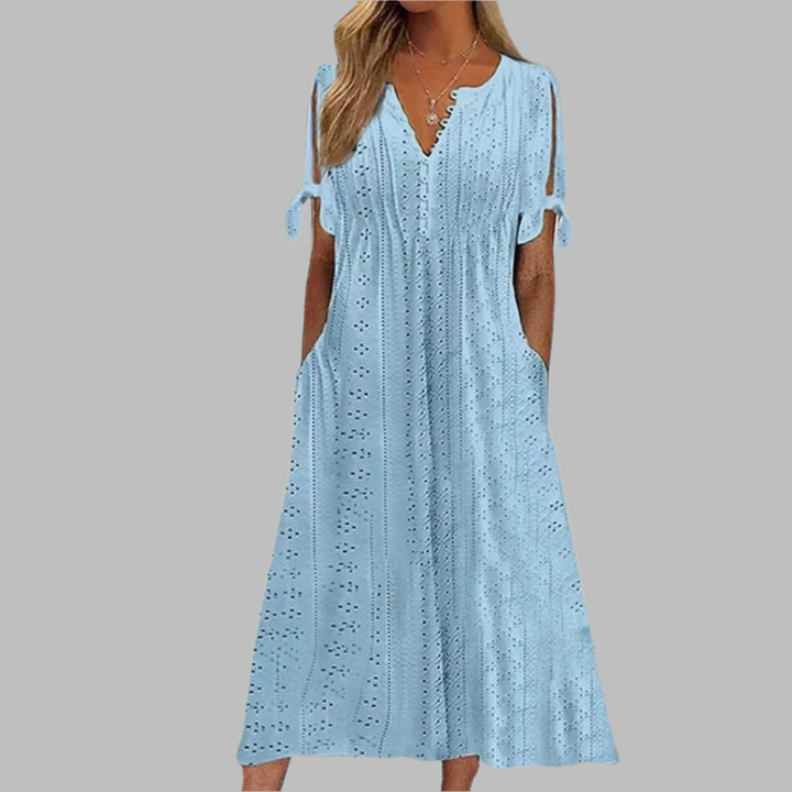 Women's elegant bohemian style midi dress in a vibrant floral pattern.