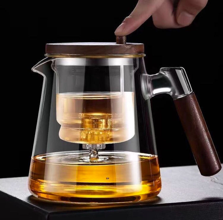 Borosilicate glass teapot with removable infuser for loose leaf tea. Heat-resistant and elegant.