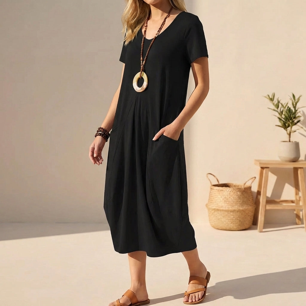 Comfortable short sleeve midi dress with pockets, ideal for everyday wear.
