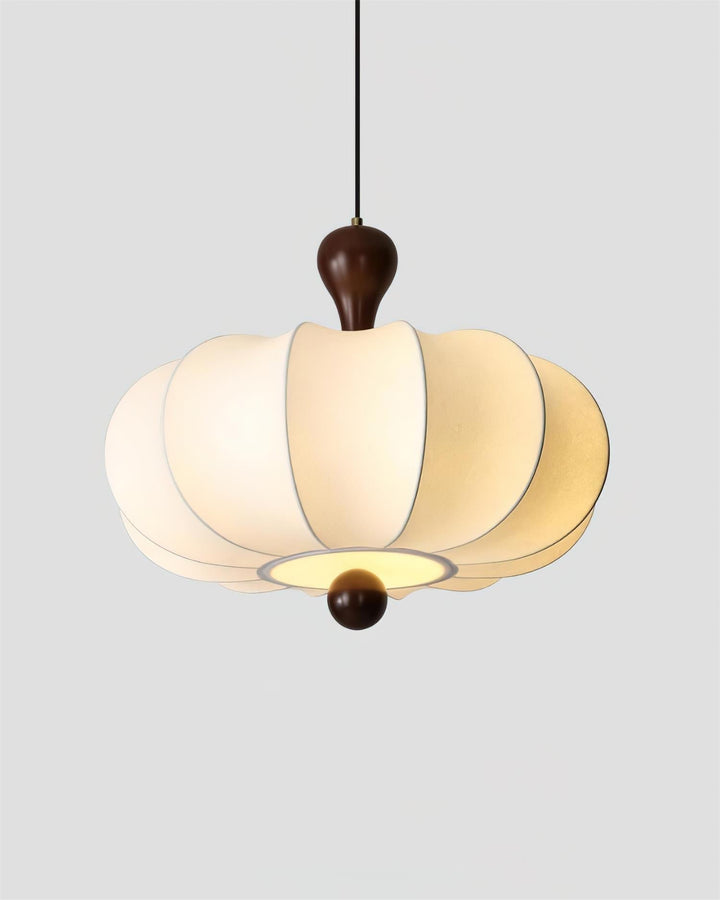 Unique Briael pendant light design with geometric walnut wood frame and soft white fabric shade diffuser.