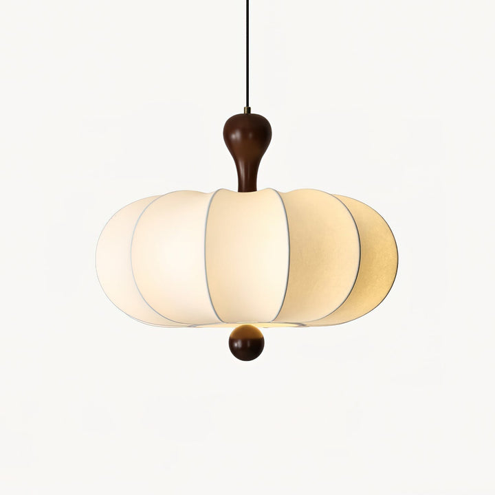 Close-up of Briael pendant light showing white fabric shade texture & detailed walnut wood frame craftsmanship.