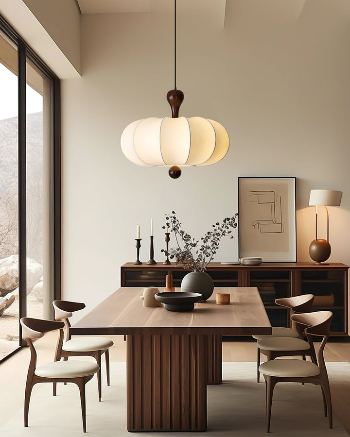 Briael modern ceiling pendant light in walnut & white, illuminating a contemporary living space interior.