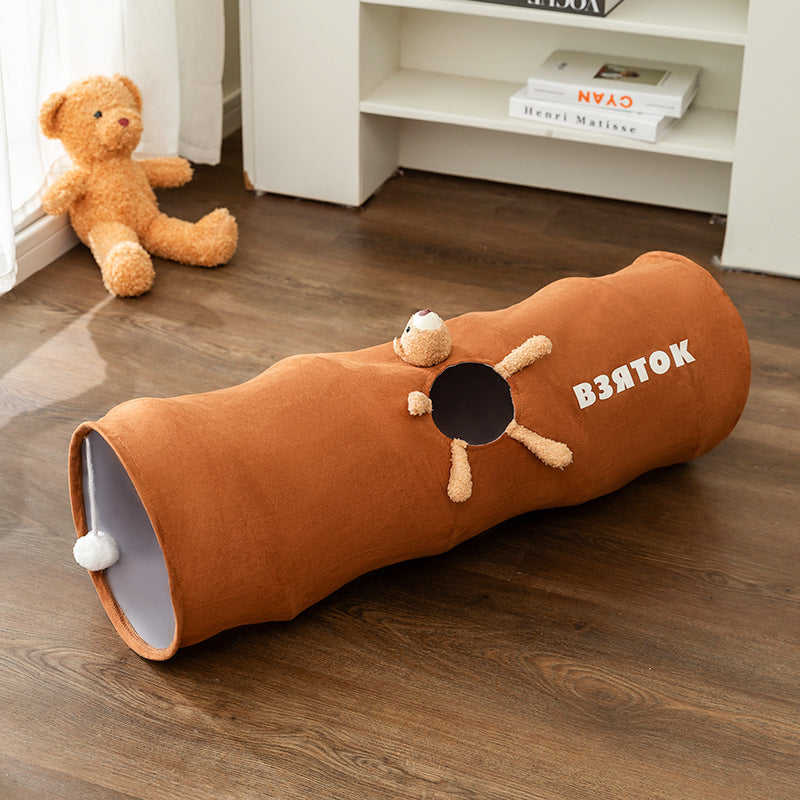 Gray plush cat toy tunnel, ideal for cats to hide and seek during playtime.
