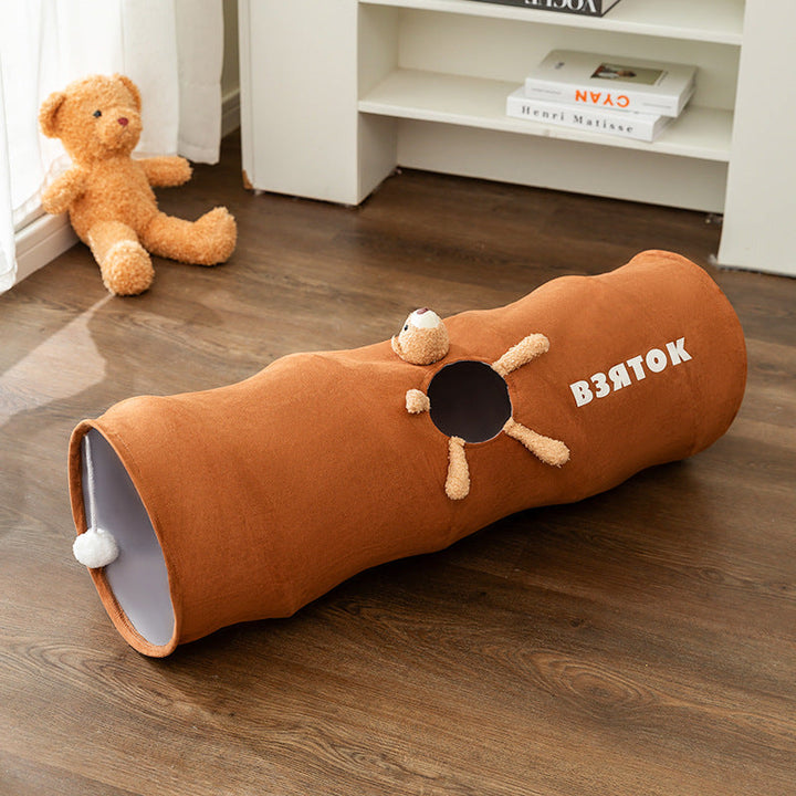 Gray plush cat toy tunnel, ideal for cats to hide and seek during playtime.