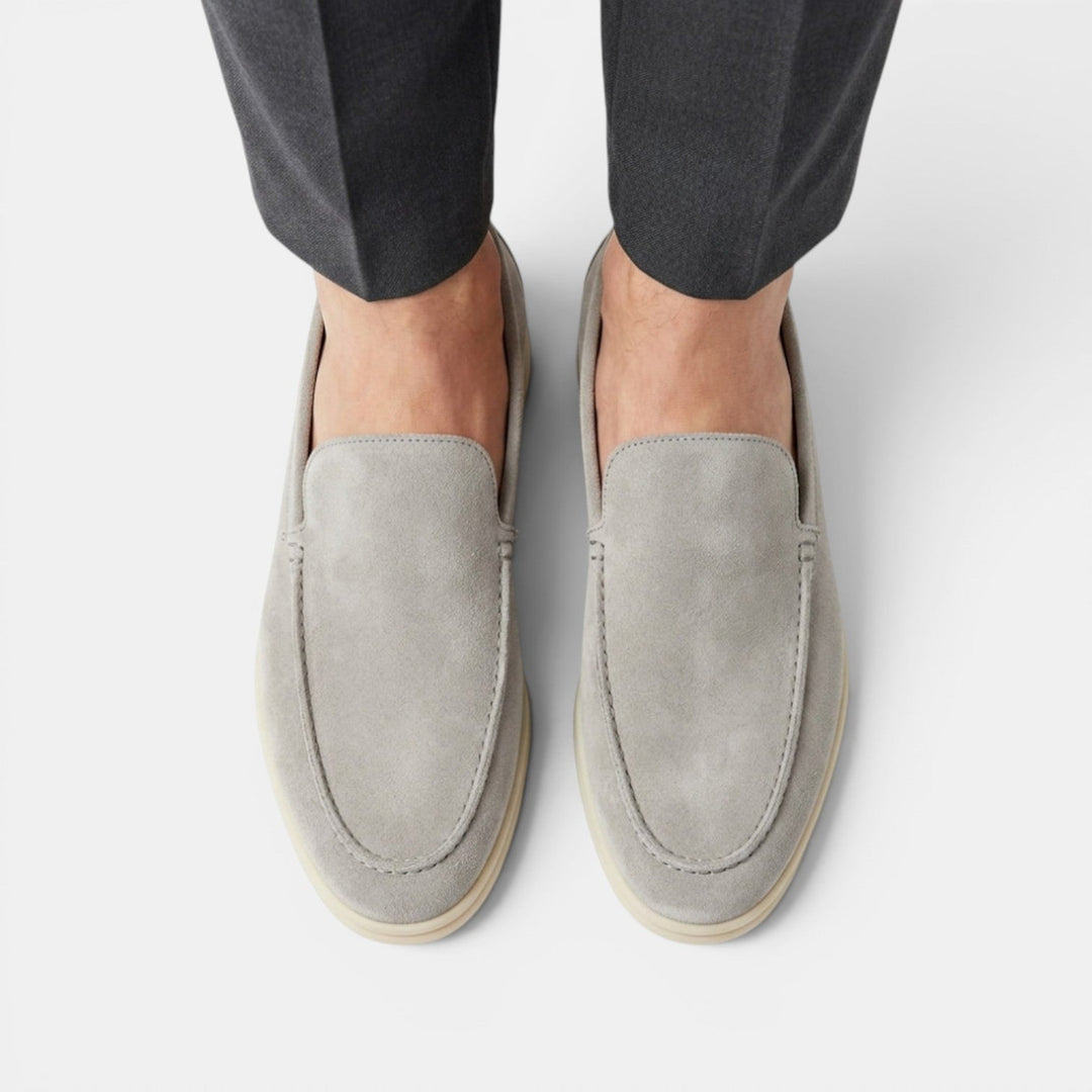 Classic black mens slip-on loafers, versatile for casual & smart dressing, easy wear.