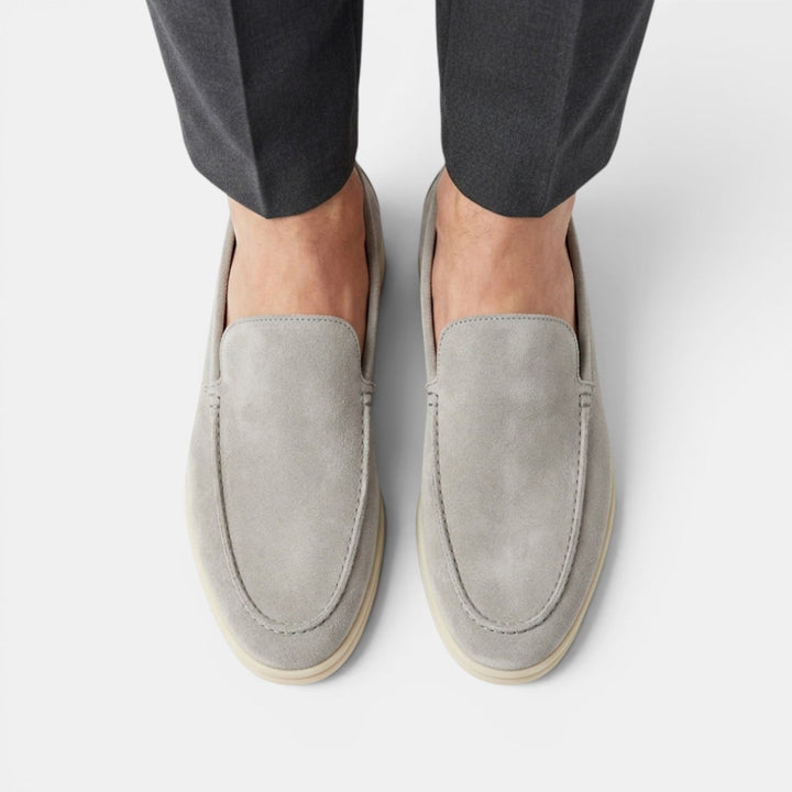Classic black mens slip-on loafers, versatile for casual & smart dressing, easy wear.