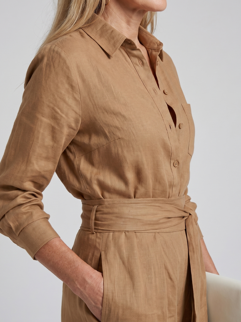 Khaki comfortable long sleeve wide leg women's jumpsuit. Easy-wear button front one-piece.