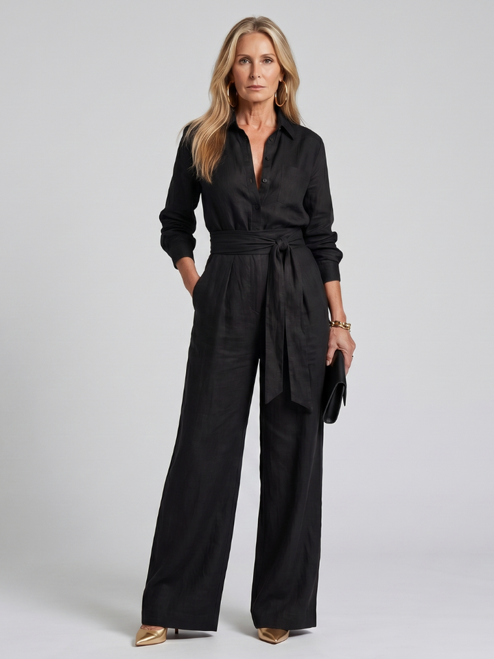 Black fashion long sleeve wide leg women's jumpsuit. Stylish button front one-piece for any occasion.
