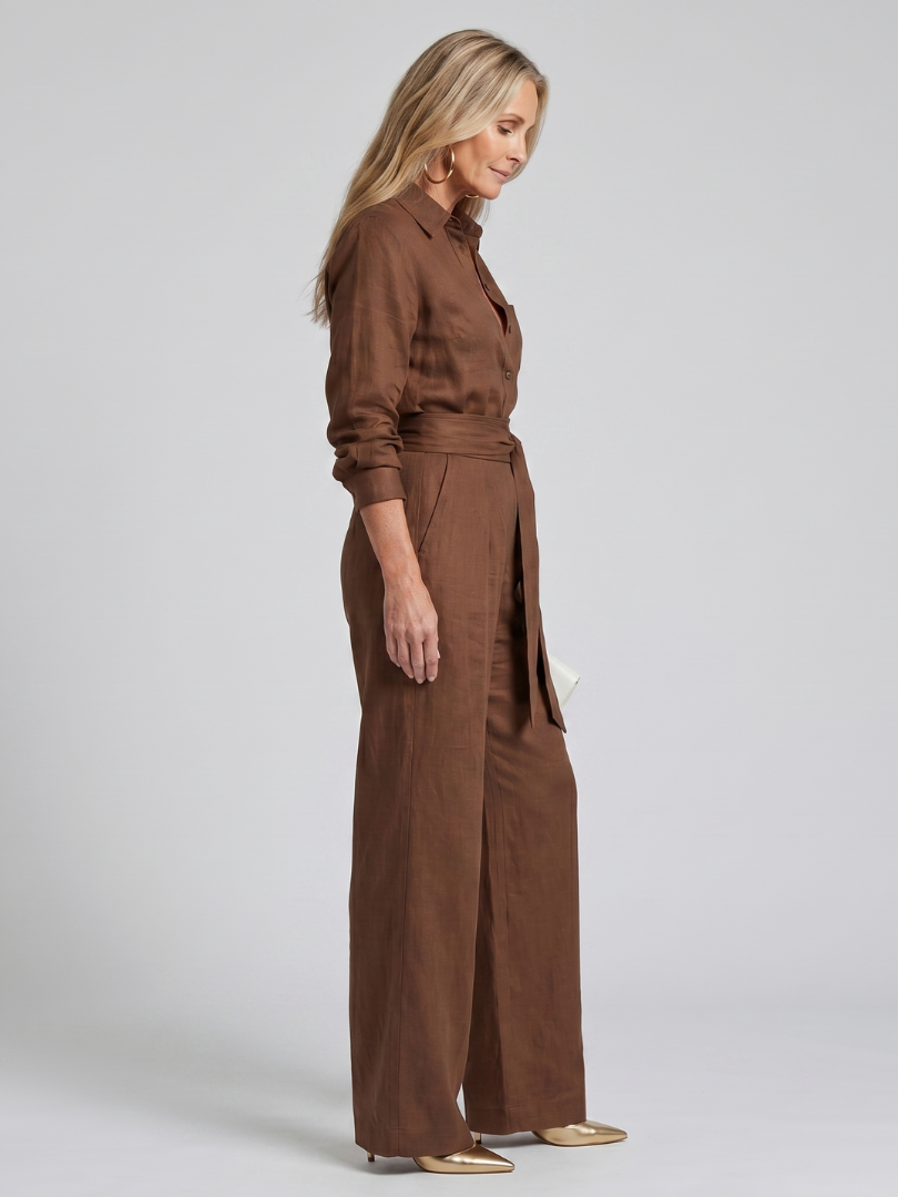 Khaki long sleeve button front wide leg women's jumpsuit. Comfortable casual one-piece style.