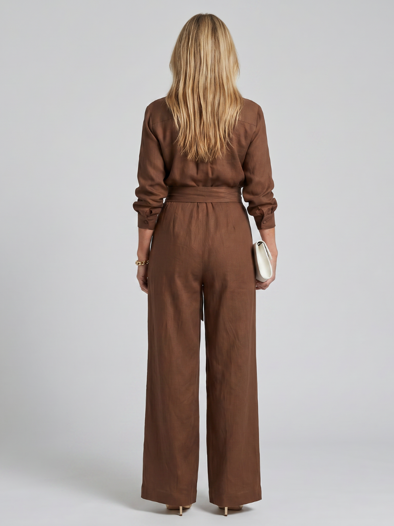Black long sleeve button front wide leg women's jumpsuit. Chic elegant fashion one-piece.