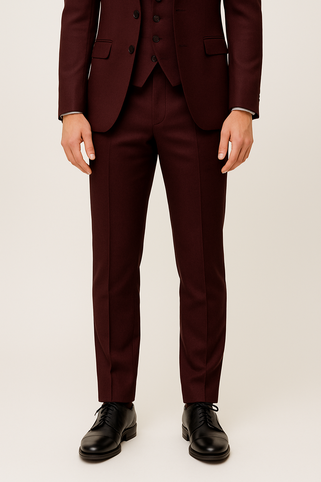 Stylish men's burgundy three-piece suit set with jacket, vest, & pants. For elegant spring formal & business wear.