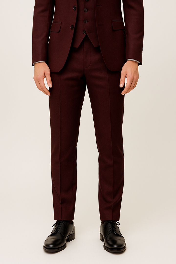 Stylish men's burgundy three-piece suit set with jacket, vest, & pants. For elegant spring formal & business wear.
