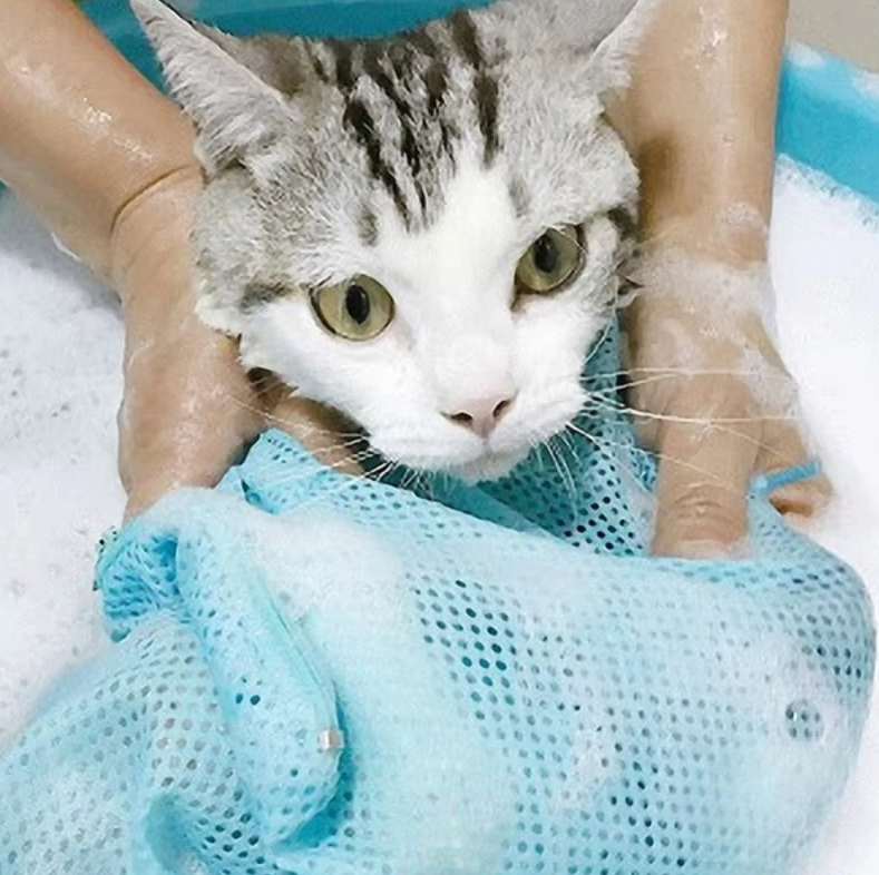 Secure Cat Bathing Sack with breathable mesh. Simplifies feline grooming & pet hygiene routine.