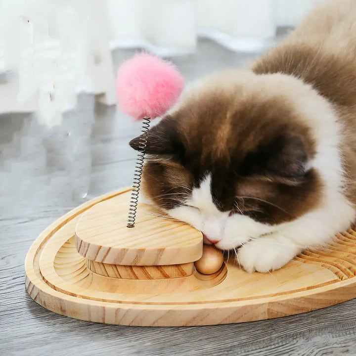 Engaging wooden cat scratcher with an interactive feather and rolling ball, perfect for feline play.