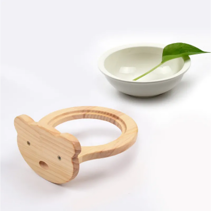 Stylish wooden cat food bowl, wall-mounted with a unique cloud frame. Modern pet accessory for comfy feeding.
